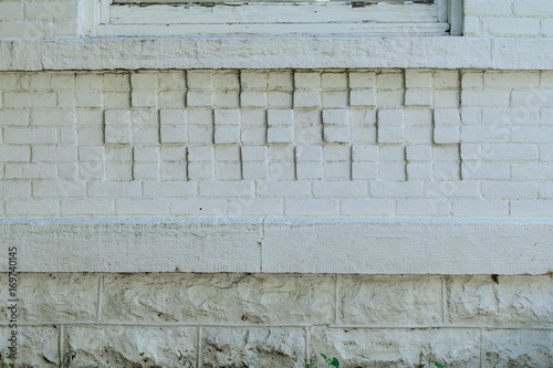 Decorative painted white brick wall and foundation