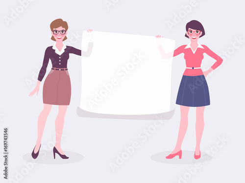 Two business women holding a blank  poster, announcement or presentation.