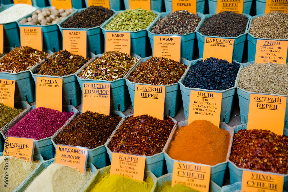 various bright spices with tag of name on  market
