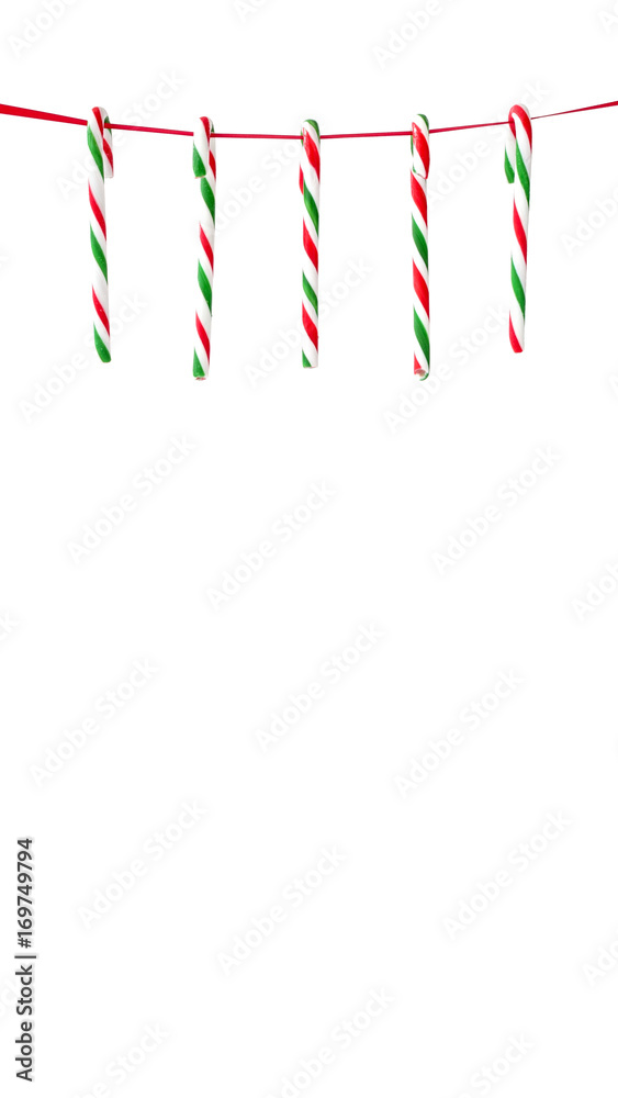 Candy Canes Hanging on Red Ribbon Candy Canes Hanging on Red Ribbon