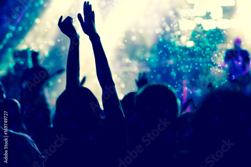 crowd with raised hands at concert - summer music festival