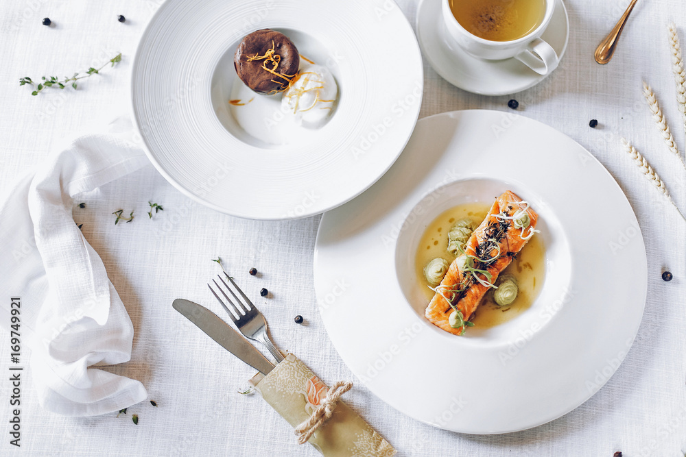 Grilled salmon on the white table flatlay background Grilled salmon on the white table flatlay background