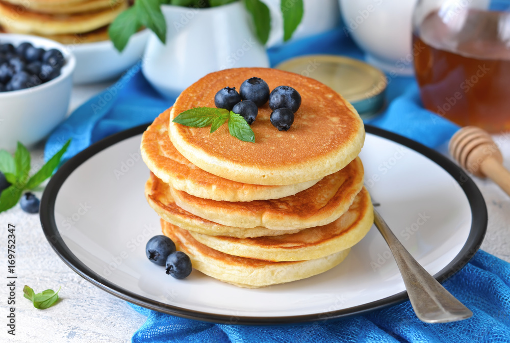Homemade vanilla punkcakes with syrup and blueberries for breakfast. Good morning! Homemade vanilla punkcakes with syrup and blueberries for breakfast. Good morning!