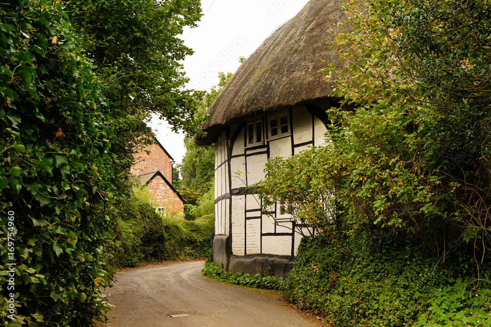 Fototapeta premium Old house in British village, summer time