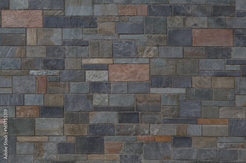 Background of processed stones with different colors of warm and cold colors with clear lines.