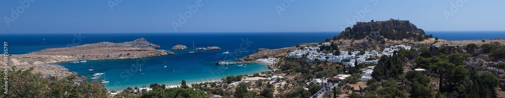 Lindos in Greece panorama beautiful beach white town and old town looking over the bay
