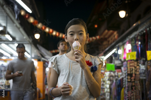 Girl having icecream in Chinatown photo