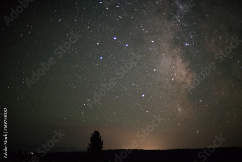 Night photography of milky way galaxy stars over north America from Grand Tetons National Park