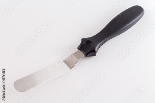 Spatula or Cake scraper for scraping fondant or icing on cake pastry of pie isolated on white background