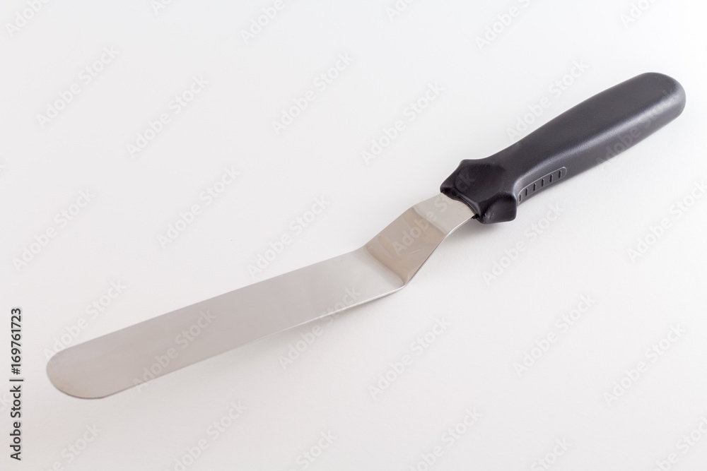Spatula or Cake scraper for scraping fondant or icing on cake pastry of pie isolated on white background Spatula or Cake scraper for scraping fondant or icing on cake pastry of pie isolated on white background