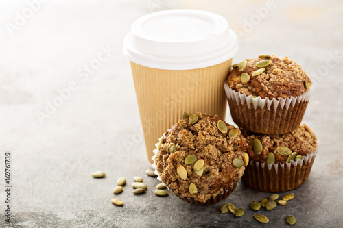 Healthy pumpkin muffins with coffee to go
