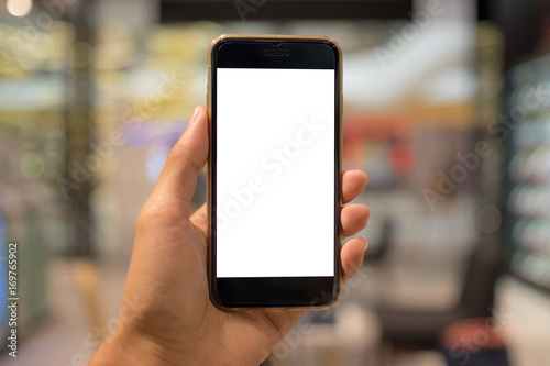 Close up of a man holding smartphone with blank screen mobile. Graphic display montage.