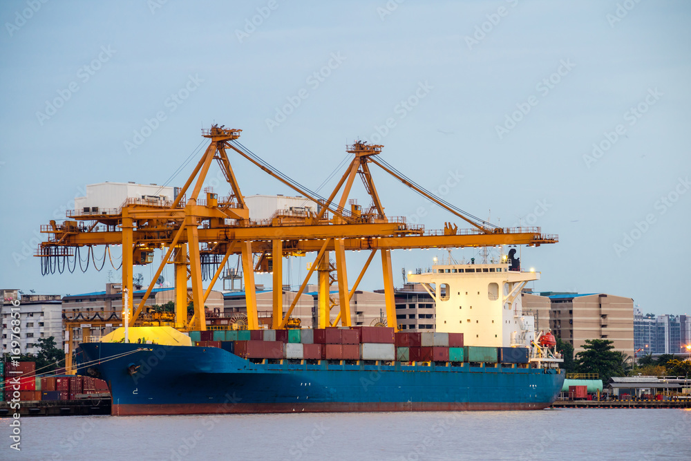 Shipping trade port. Container cargo ship loading or unloading by crane bridge. Logistics industrial and transportation business background