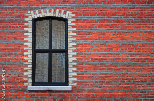 red brick wall window curtain home building