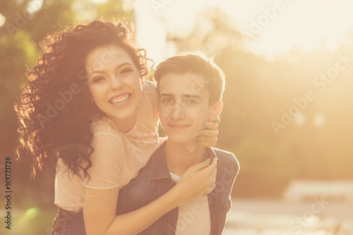 Teenagers in park at sunset