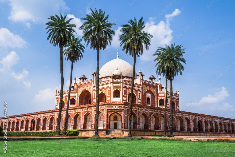 Humayun's Tomb a UNESCO World Heritage site with blue sky and date palm