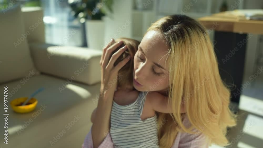 Kind mother soothing the child Kind mother soothing the child