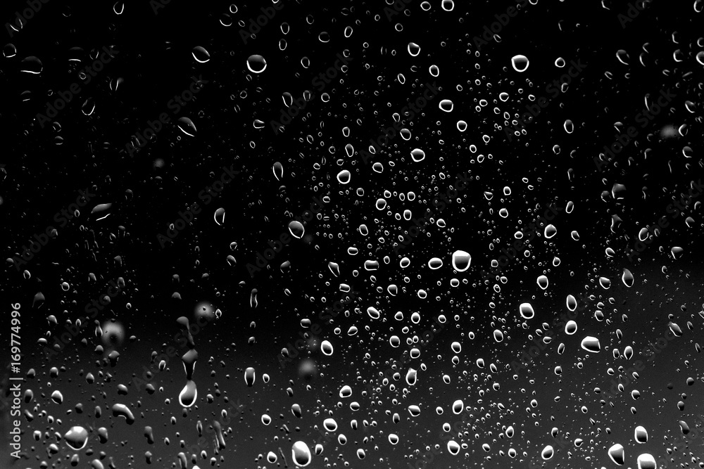 Raindrops on black glass