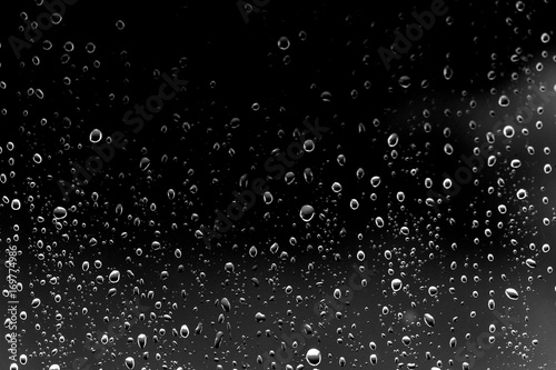 Raindrops on black glass
