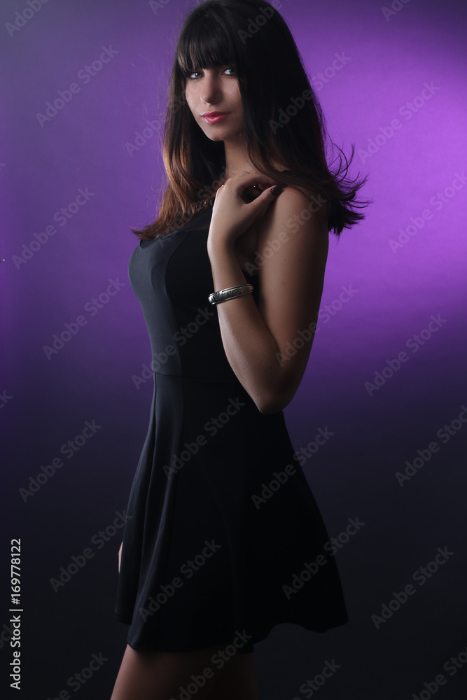 Obraz premium young beautiful stylish woman in black dress