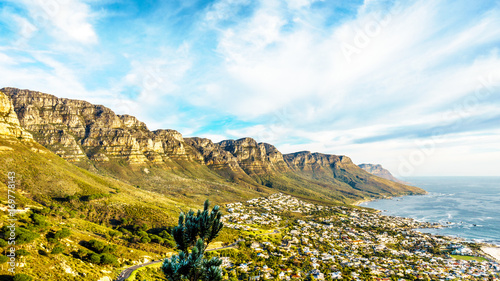 The back side of Table Mountain, called the Twelve Apostles, with the beach community of Camps Bay at the foot of the mountain on a nice winter day