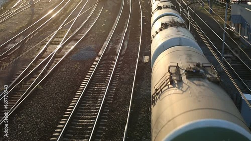 Freight train passing by at sunset