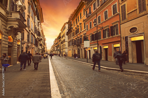 people walking on wall street with european building style in rome italy use as background and backdrop and traveling scene © stockphoto mania