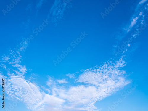 Fluffy clouds in the bright blue sky