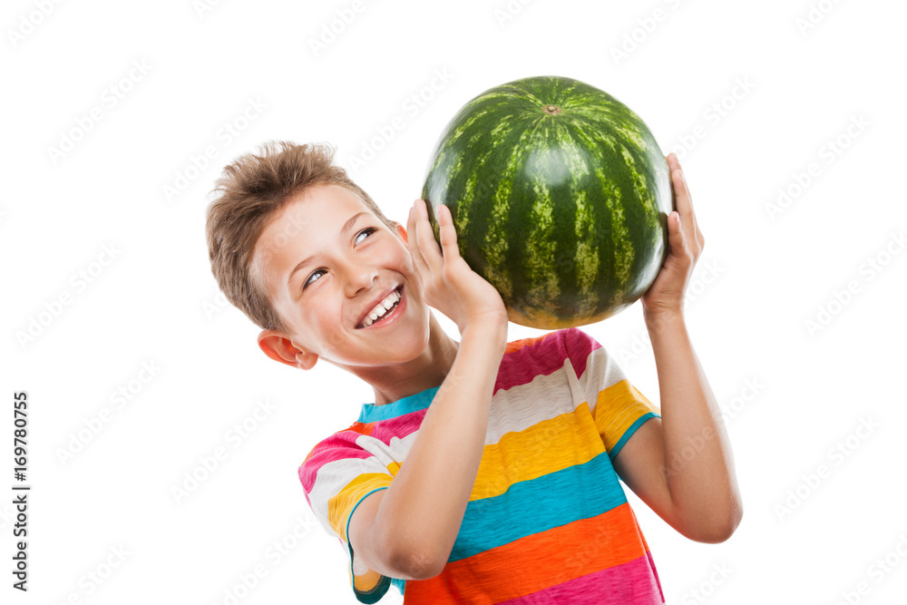 Handsome smiling child boy holding green watermelon fruit Handsome smiling child boy holding green watermelon fruit