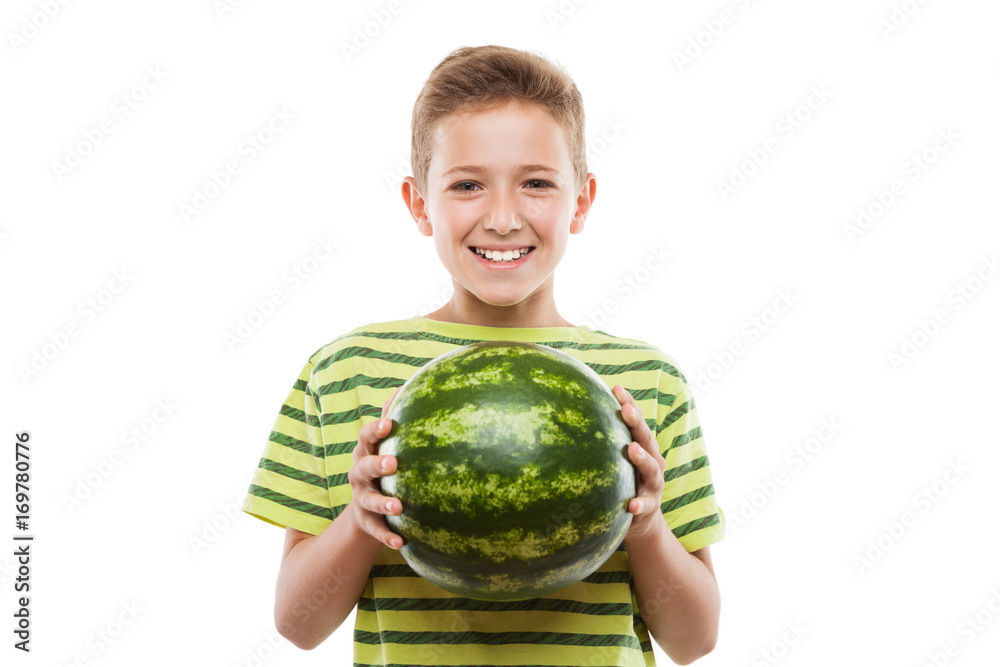 Handsome smiling child boy holding green watermelon fruit Handsome smiling child boy holding green watermelon fruit