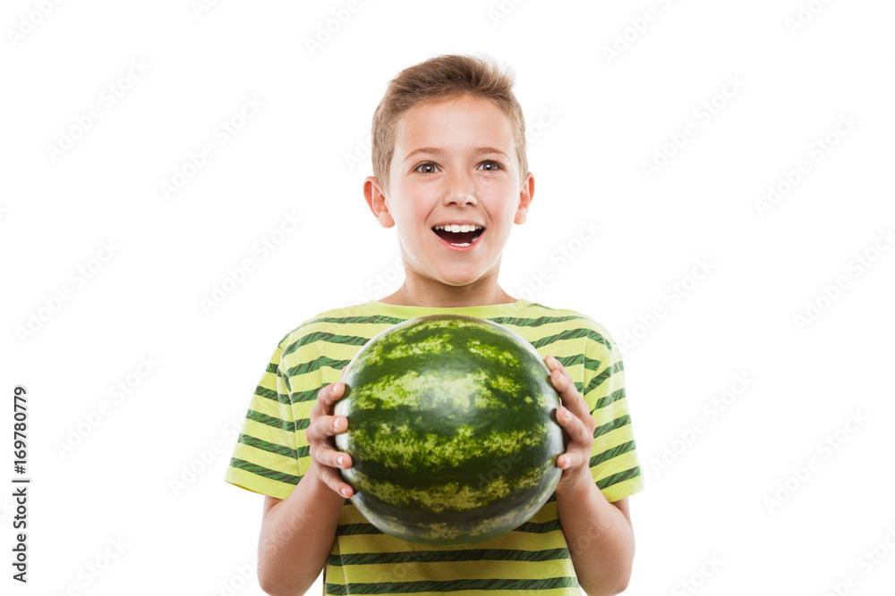 Handsome smiling child boy holding green watermelon fruit Handsome smiling child boy holding green watermelon fruit