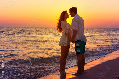Romantic couple kissing on the beach