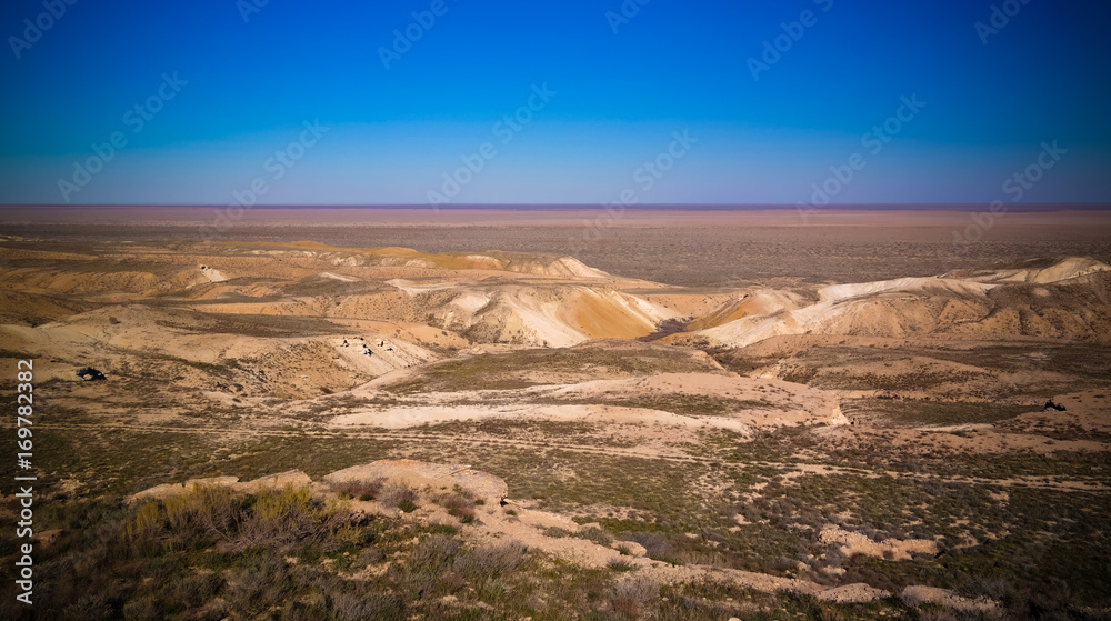 Panorama view to Aral sea from the rim of Plateau Ustyurt at sunset in Karakalpakstan, Uzbekistan