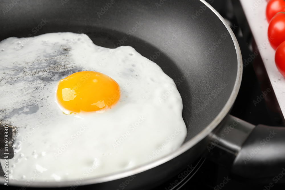Cooking of delicious sunny side up egg, closeup Cooking of delicious sunny side up egg, closeup