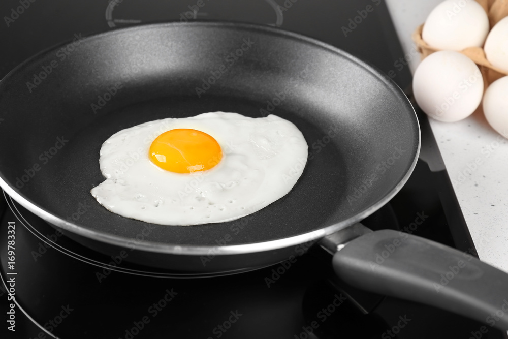 Cooking of delicious sunny side up egg, closeup Cooking of delicious sunny side up egg, closeup