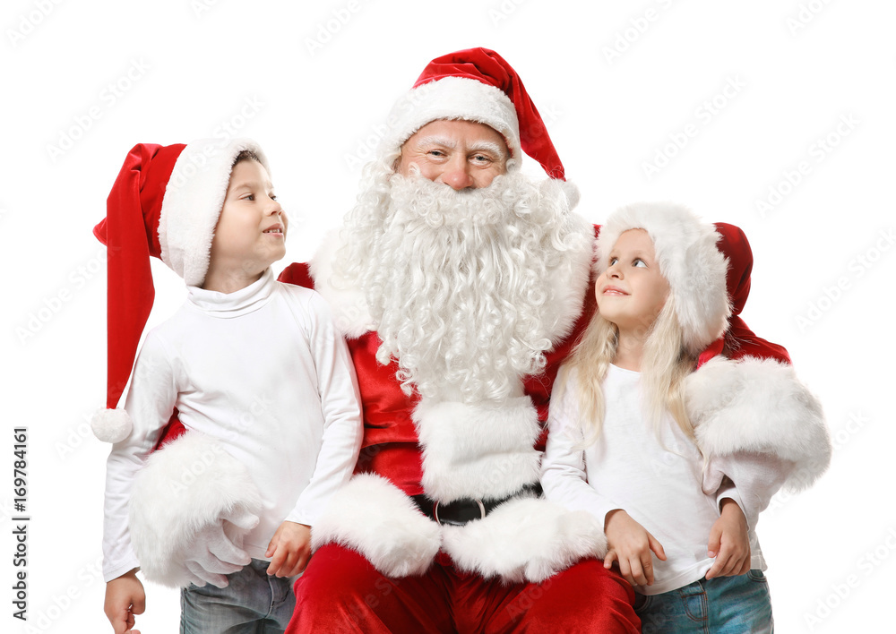 Cute kids in Christmas hats and authentic Santa Claus on white background Cute kids in Christmas hats and authentic Santa Claus on white background
