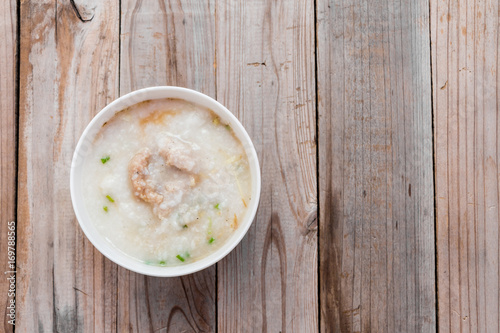 Thai rice porridge with pork on table,pork congee photo
