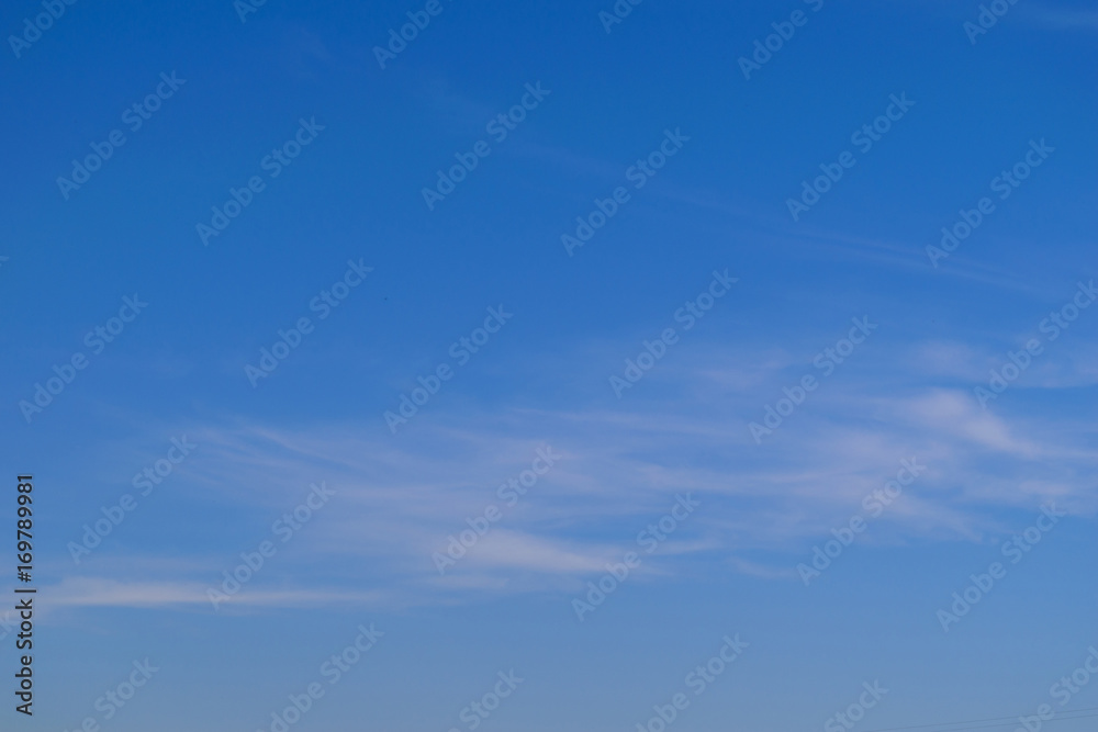 Background of blue sky and white cirrus clouds.