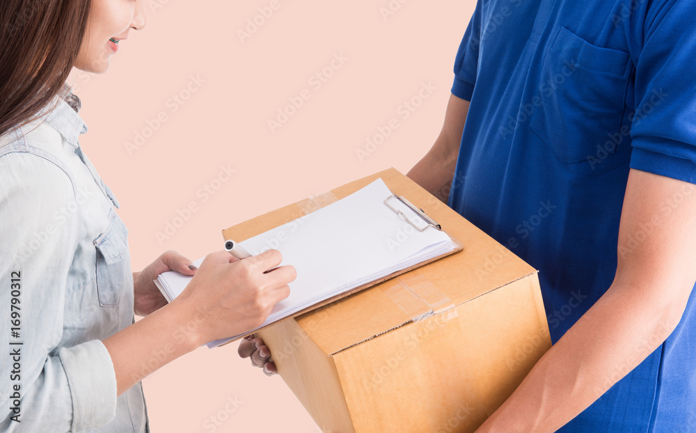 Delivery man giving a cardboard box to young woman,clipping path. Delivery man giving a cardboard box to young woman,clipping path.