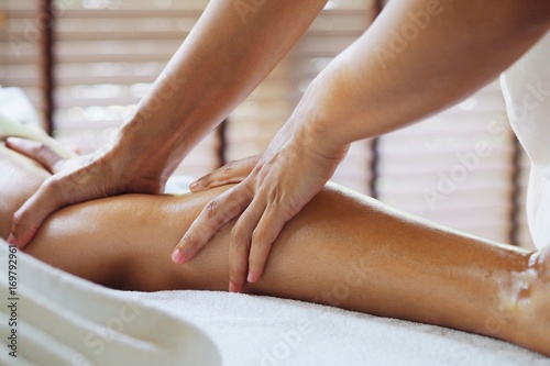 Wallpaper Mural Therapist doing massage foot massage in spa treatment room. Torontodigital.ca