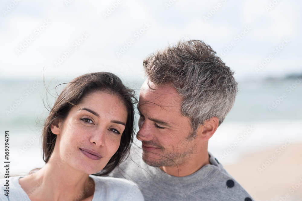 Portrait of a middle-aged couple having fun on the beach