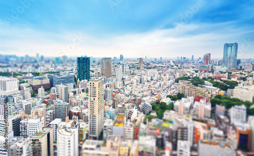 Business and culture concept - panoramic modern city skyline bird eye aerial view from tokyo tower under dramatic grey cloudy sky in Tokyo  Japan. Miniature Tilt-shift effect