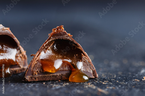 Original chocolate praline candy with liquid salted carame photo