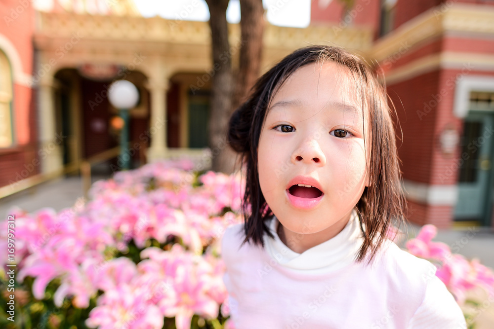 Cute Asian girl with pink flower field outdoor with natural light. Cute Asian girl with pink flower field outdoor with natural light.