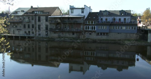 Traditional buildings facing Grand River in Elora, Ontario, Canada. Elora is a community known for its limestone architecture, its artistic community and the Elora Gorge. photo