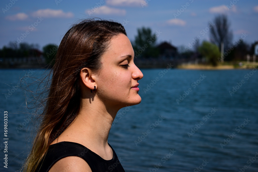 young women enjoying by the water 