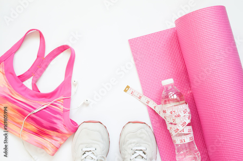Creative flat lay of sport equipments in pink collection, Gym and workout