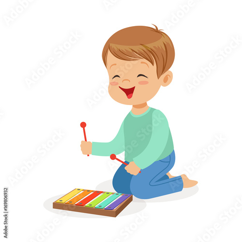 Cute little boy playing xylophone, young musician with toy musical instrument, musical education for kids cartoon vector Illustration