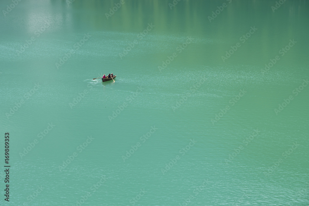 Fototapeta premium Boat on the Braies lake in the Dolomite Alps, Sudtirol, Italy.