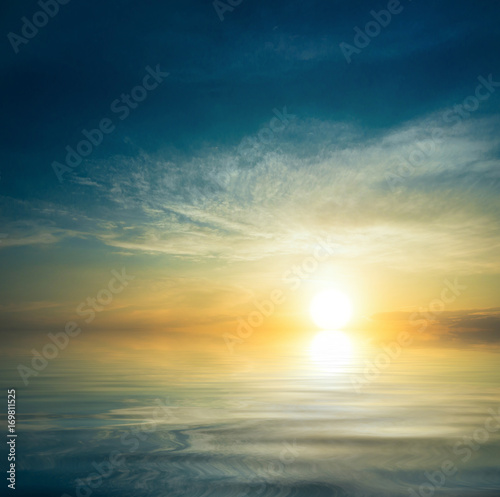 Fototapeta Naklejka Na Ścianę i Meble -  Sunset on windless, calm sea.
